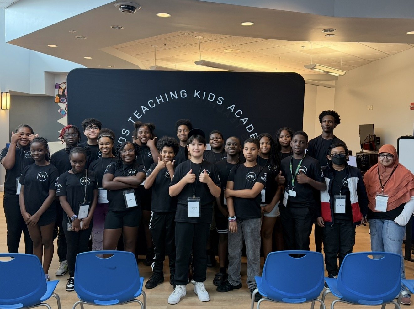 All of last summer's campers and teachers in front of the KTK backdrop